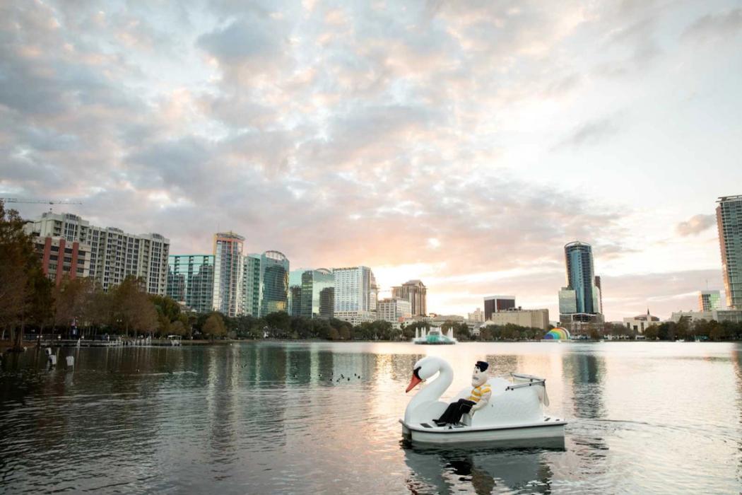 Tommy Tar in a swan boat on Lake Eola.