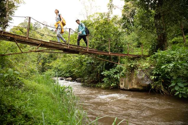 Students crossing a bridge on a field study in Tanzania.