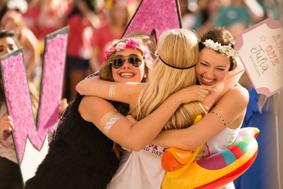 Students embrace on sorority bid day.