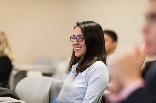 A female business student in class.