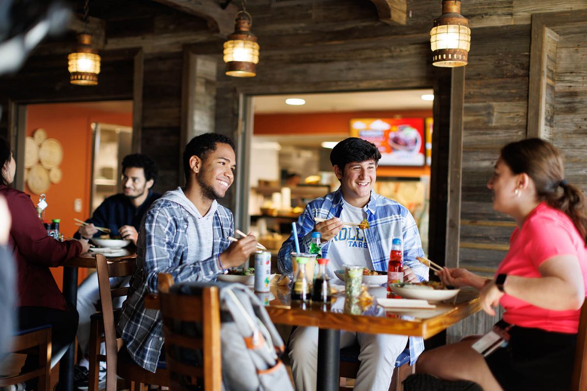 Three students enjoying lunch at Dave’s Boathouse