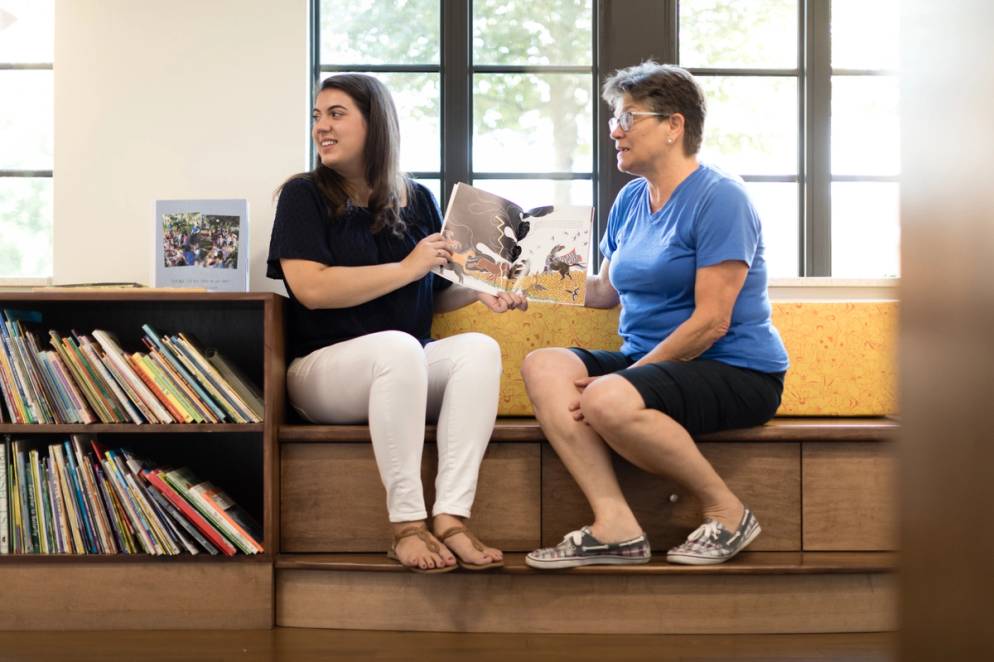 Tomkunas sits with one of her mentors.