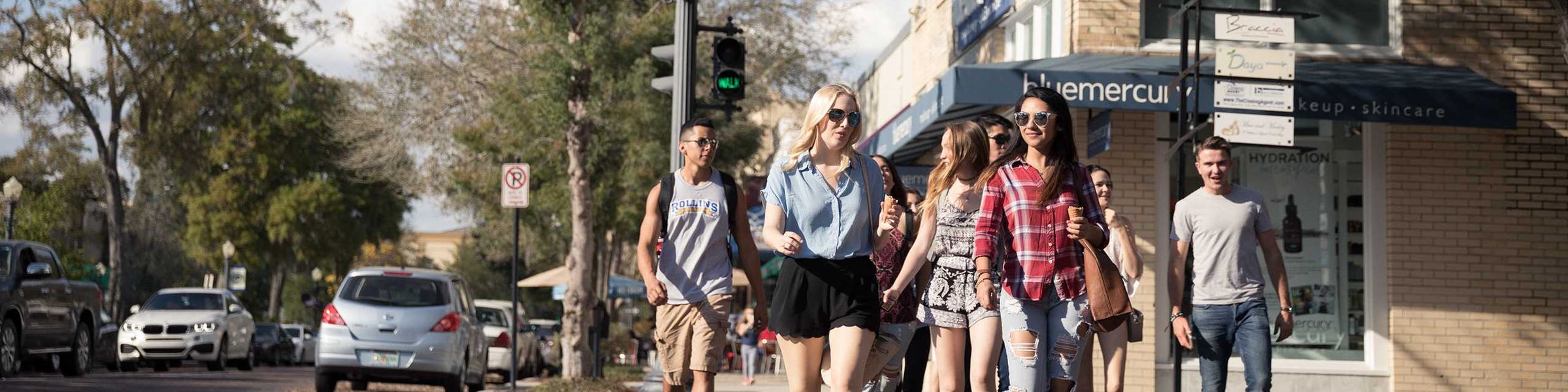 A group of Rollins College students crossing the brick roads in downtown Winter Park, FL.