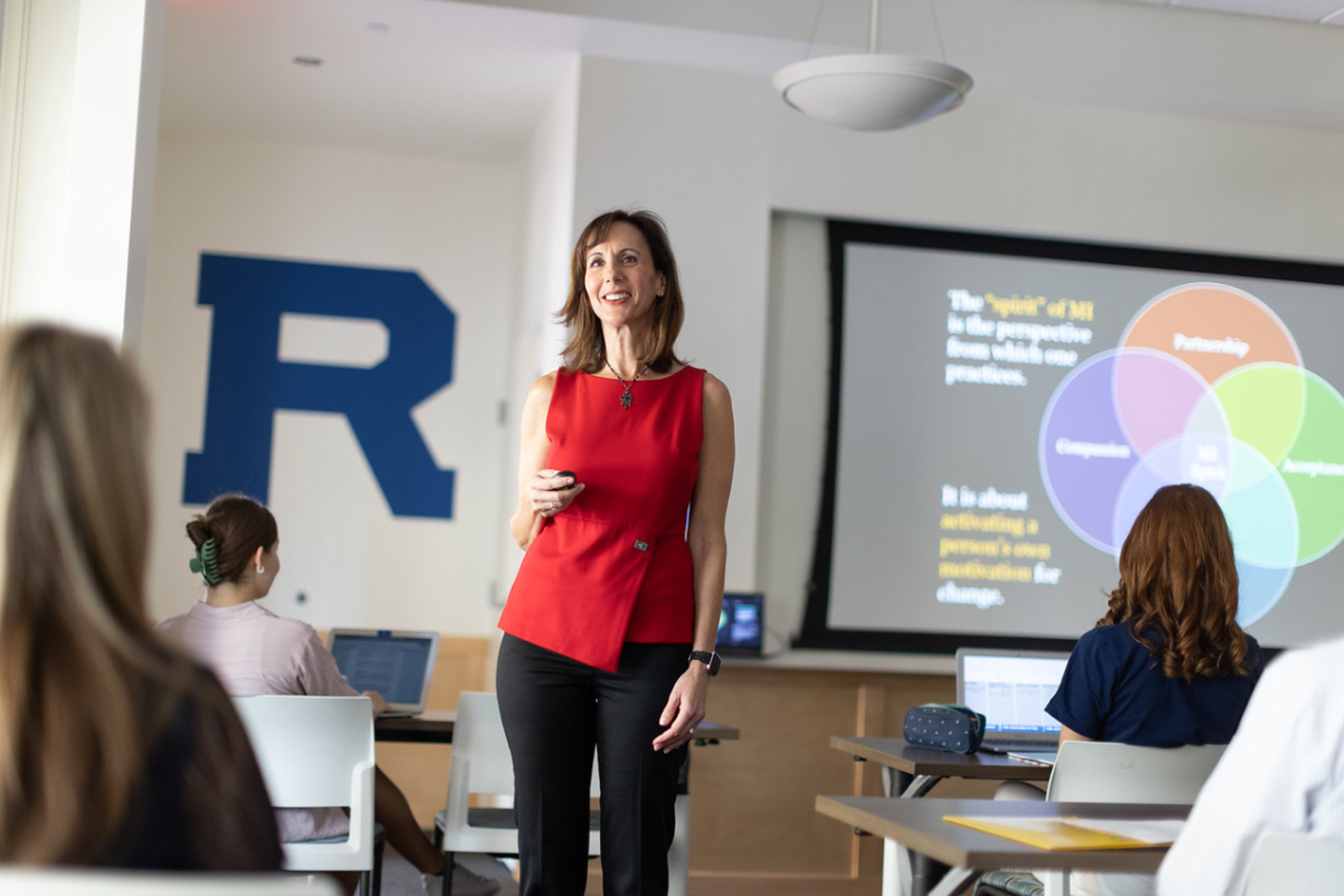 Professor showcasing a powerpoint presentation