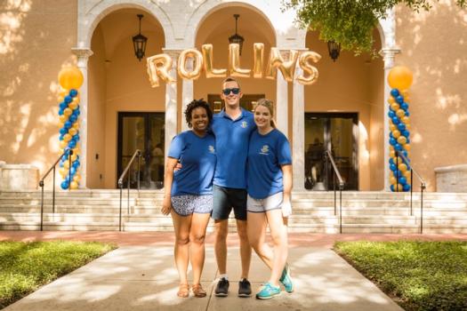 Three students pose during orientation at Rollins.