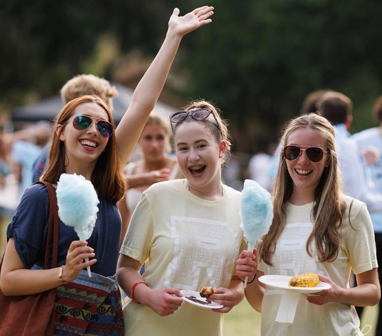 Three students at the Fox Day picnic