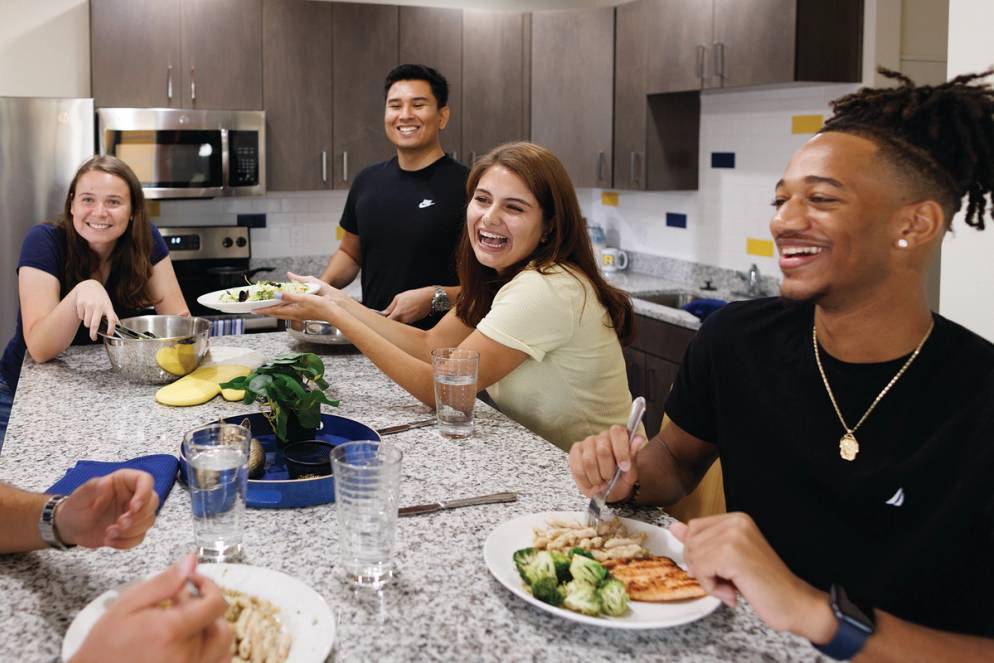 Students interacting in a kitchen