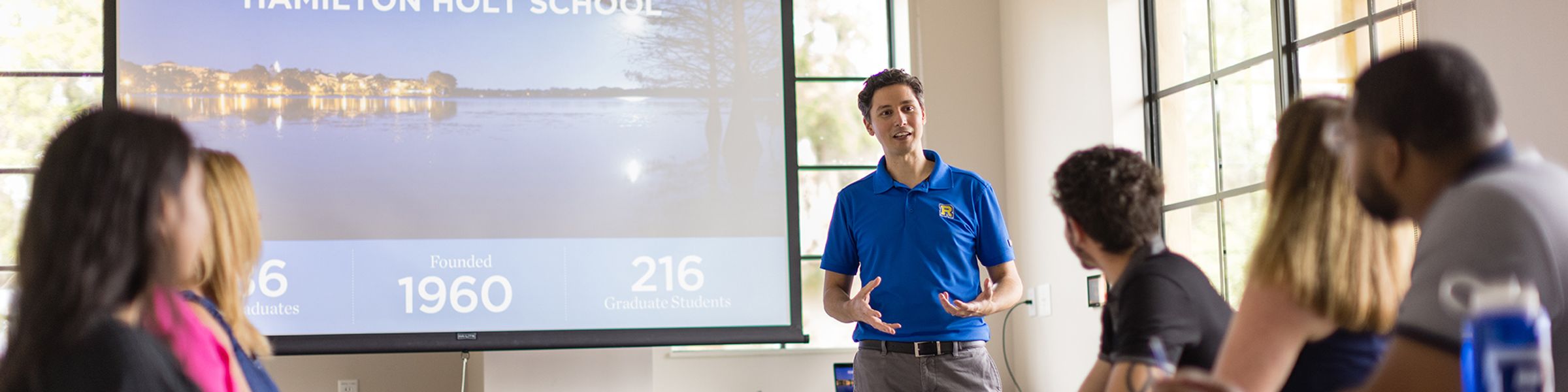 An admission counselor leads an information session at Rollins.