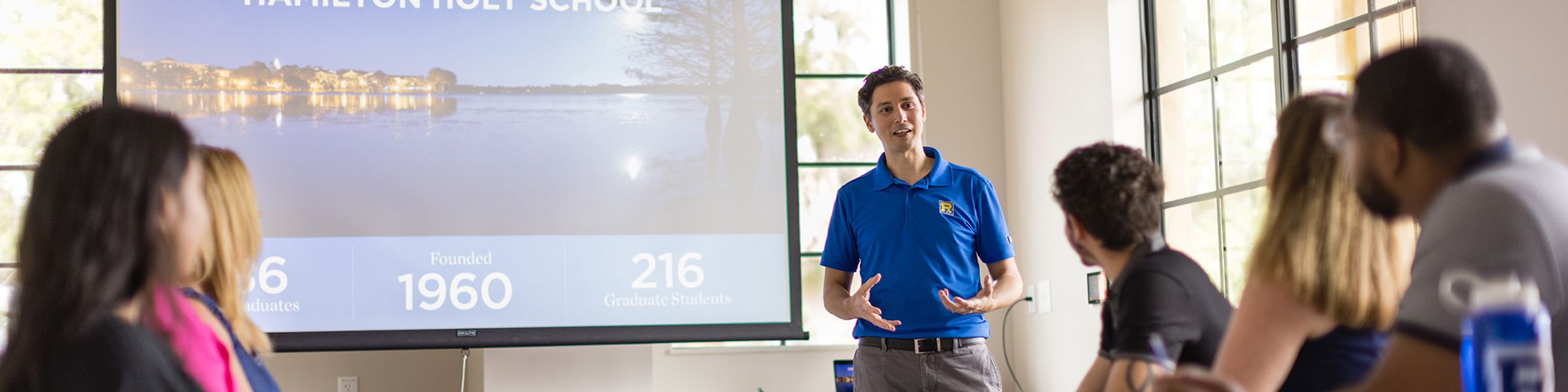 An admission counselor leads an information session at Rollins College.