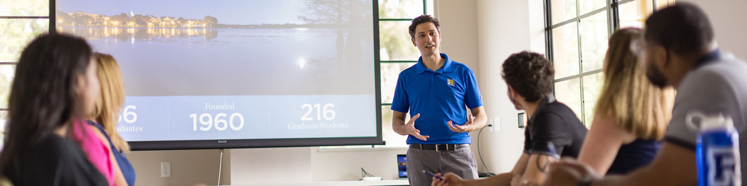 An admission counselor leads an information session at Rollins.