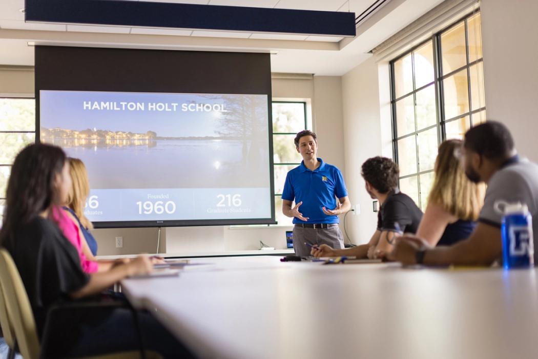 An admission counselor leads an information session at Rollins.