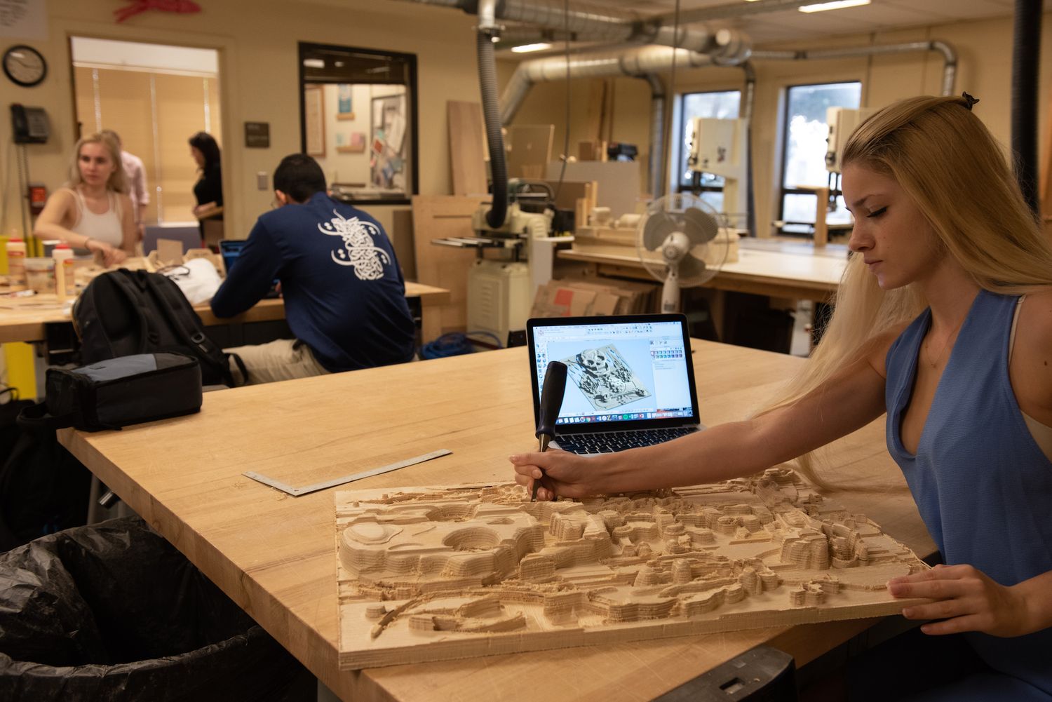 A Rollins student creates a 3D art display.