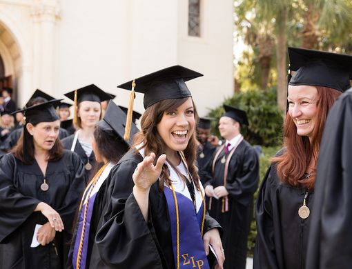 Rollins College students happy at graduation ceremony.