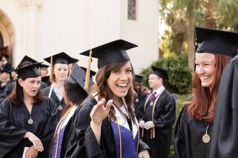 Rollins College students happy at graduation ceremony.