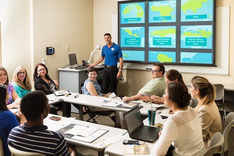 a professional meeting set in a Rollins classroom