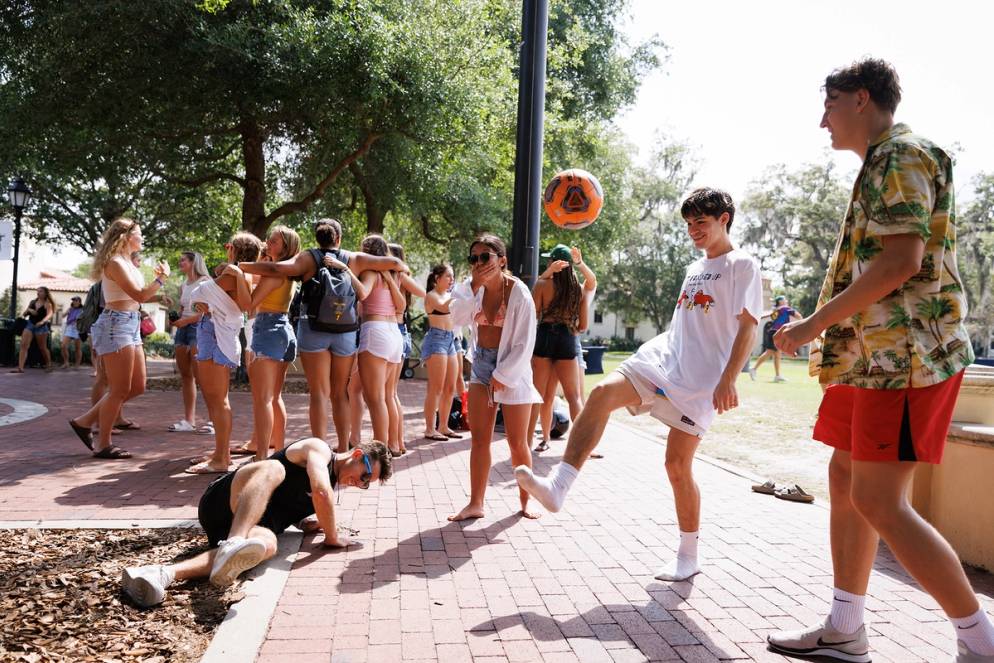 Students kicking a ball around on Fox Day.