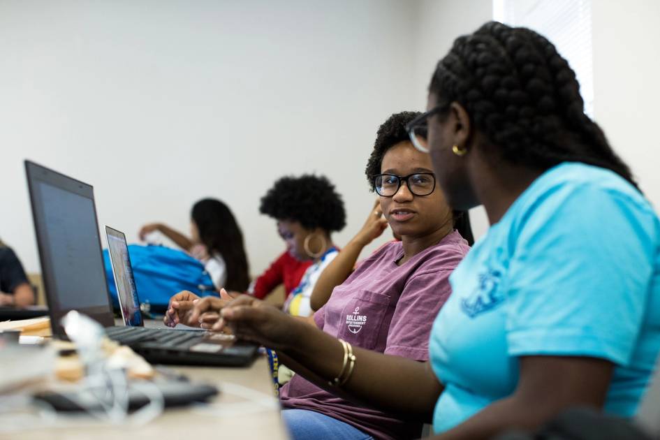 Rollins sociology students working together on a group project.