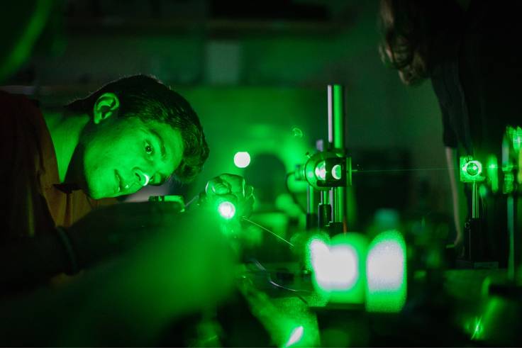 A student participates in research with lasers led by physics professor Ashley Cannaday.