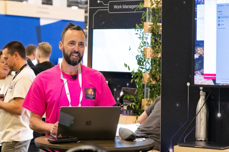 An expert from The Adaptavist Group presenting at an event booth