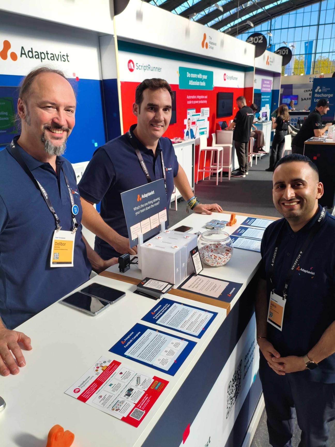 A group of people smiling at an event booth