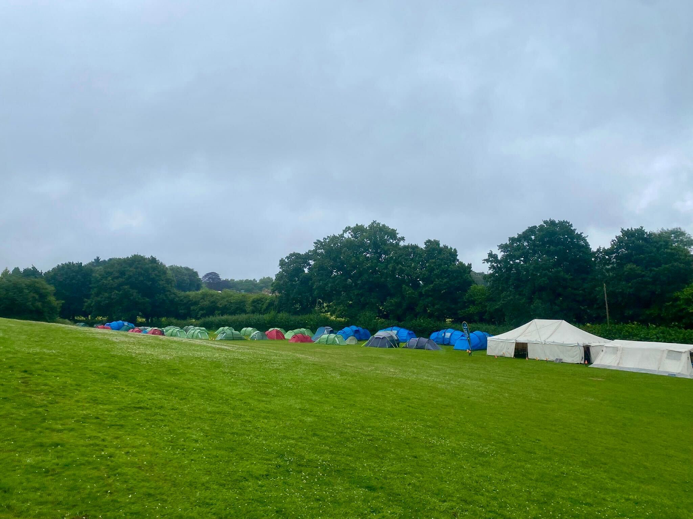 A large group of tents in a field, part of a Scout camp