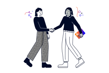 Two people shake hands