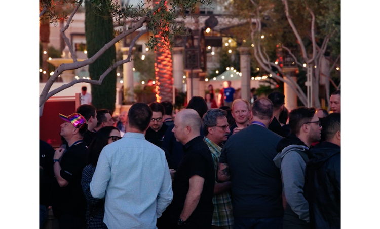 A crowd of people at an outdoor party