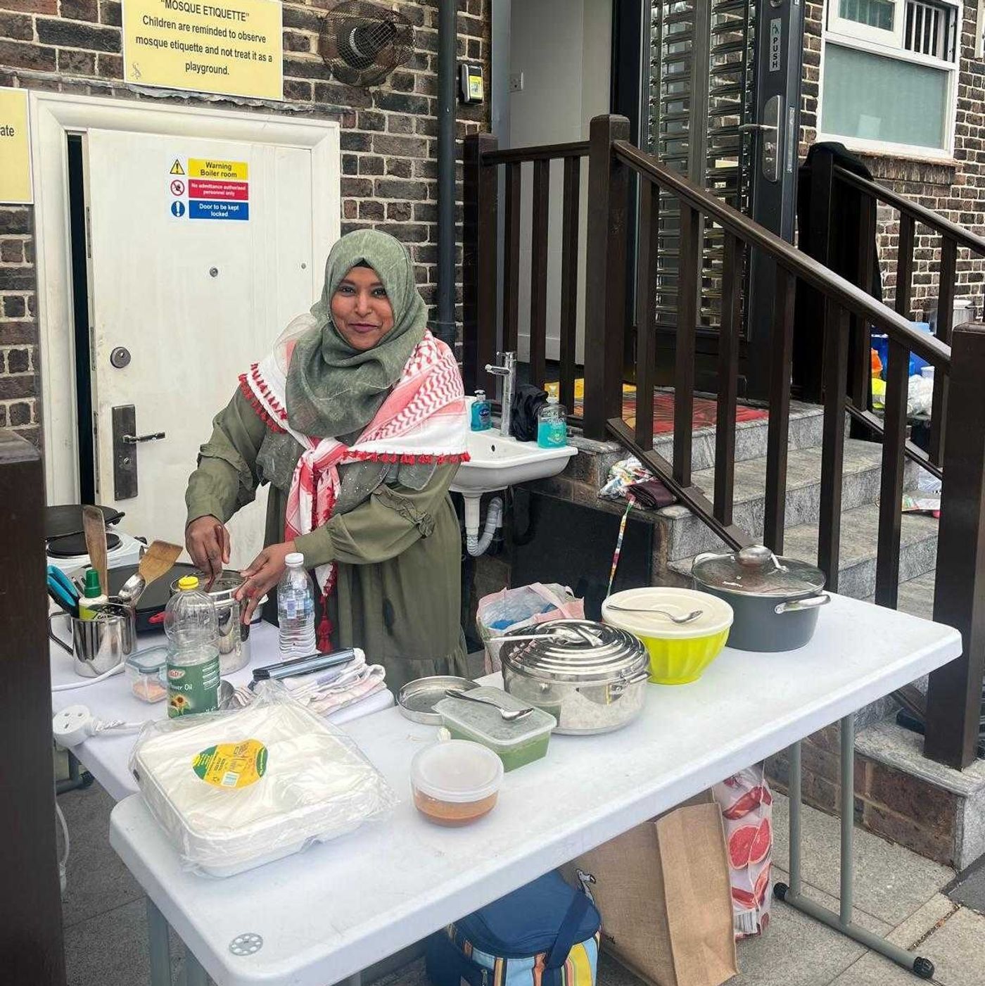 Nisha serving food at a fundraising event