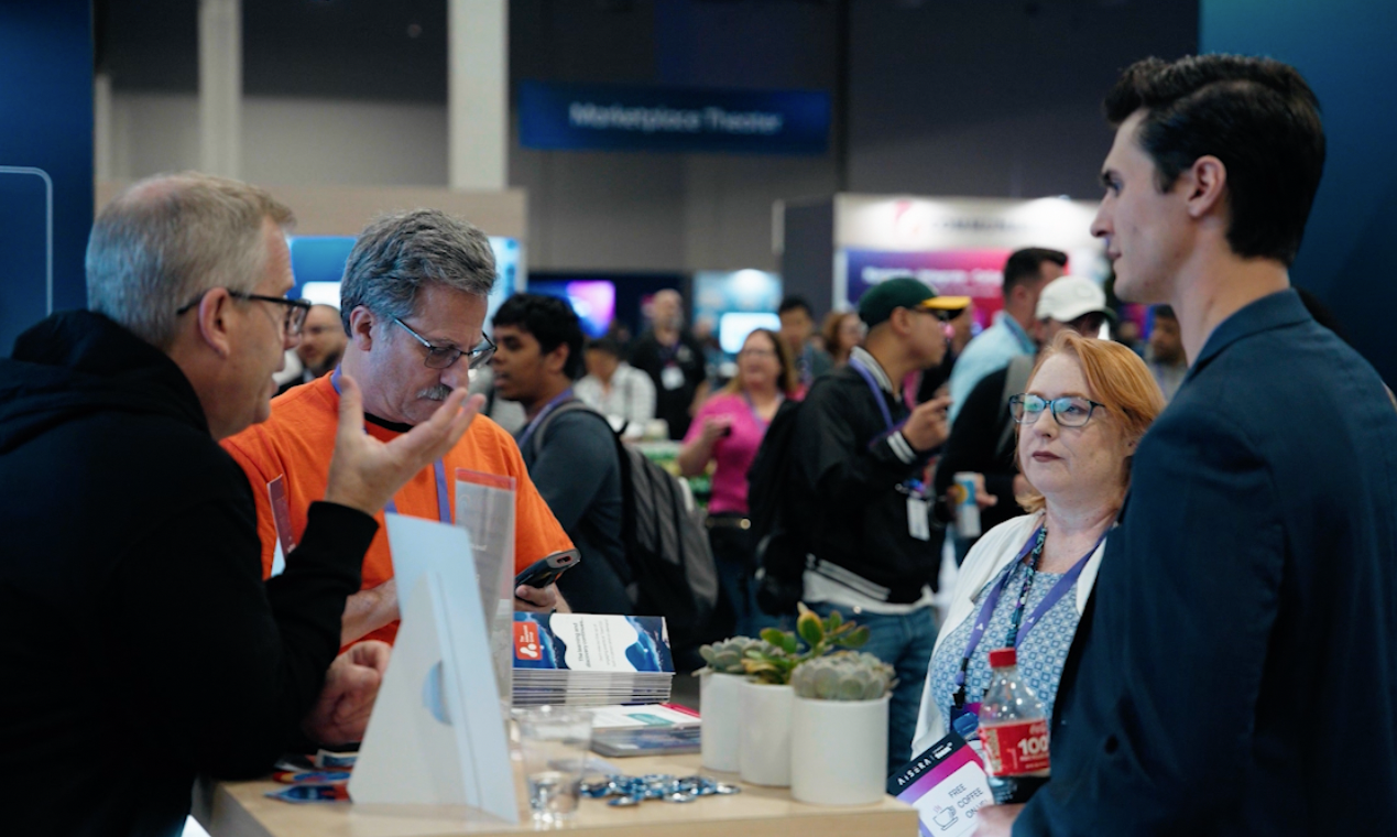 A group of people in conversation at an event