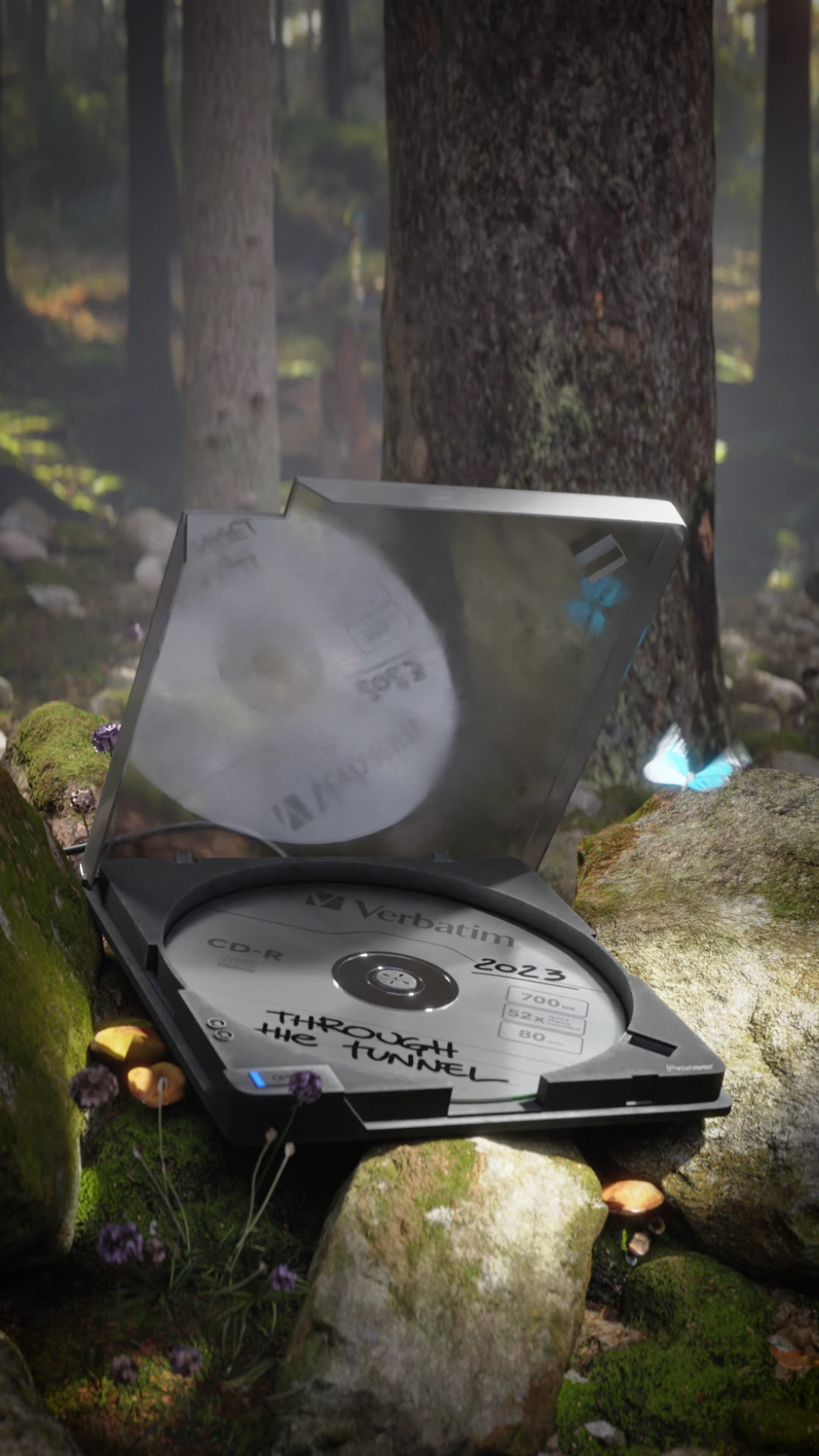 An open CD player holds a disc labeled “Through the Tunnel” among mossy forest rocks, with a blue butterfly hovering on the right of the frame.