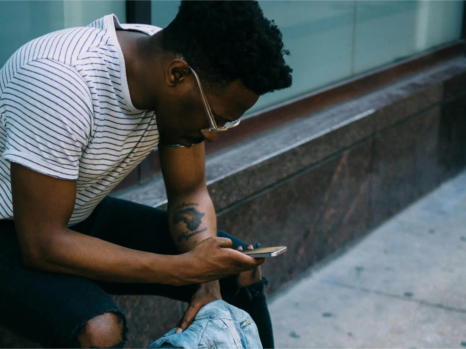 A person scrolling on their phone looking at polkadot dapps
