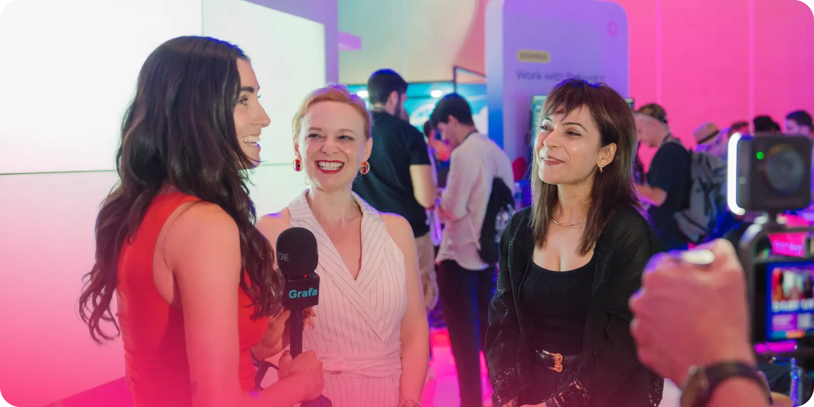 Polkadot ecosystem leaders being interviewed at Token 2049 in Singapore near the Polkadot booth