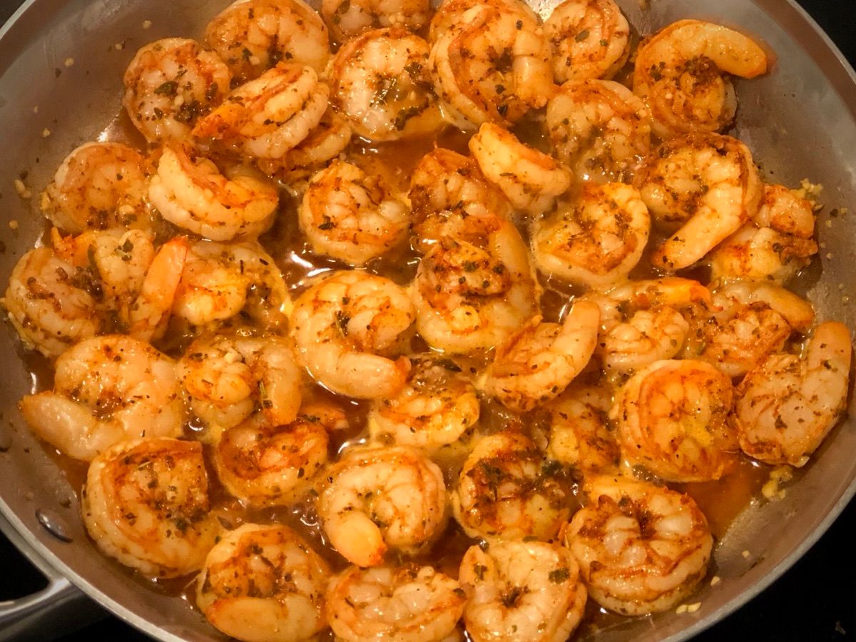 A skillet of buttery sauteed shrimp