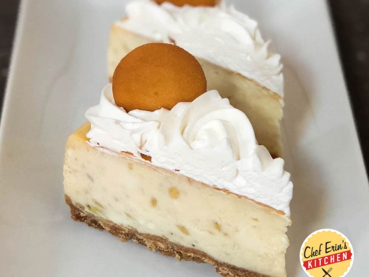 A slice of banana pudding cheesecake topped with whipped topping and a Nilla wafer