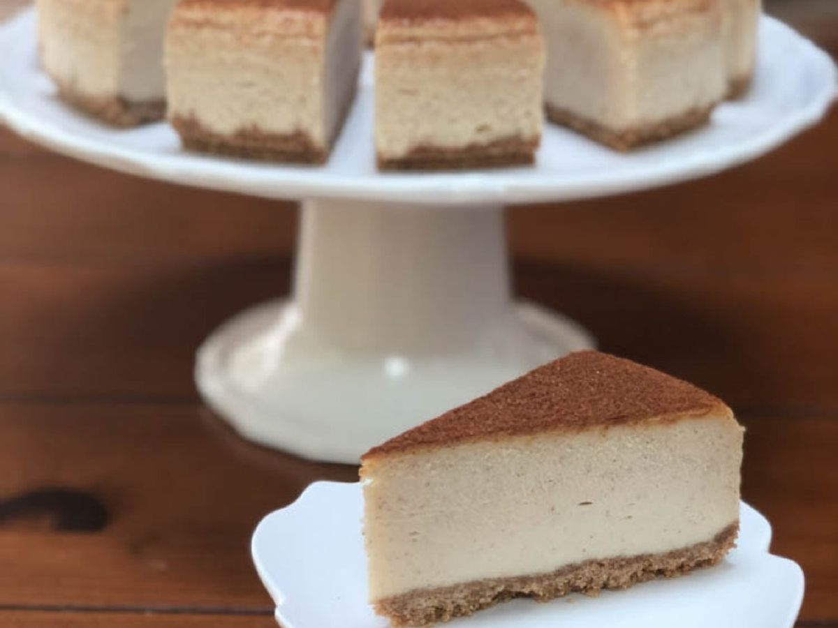 A slice of snickerdoodle cheesecake dusted with cinnamon sugar