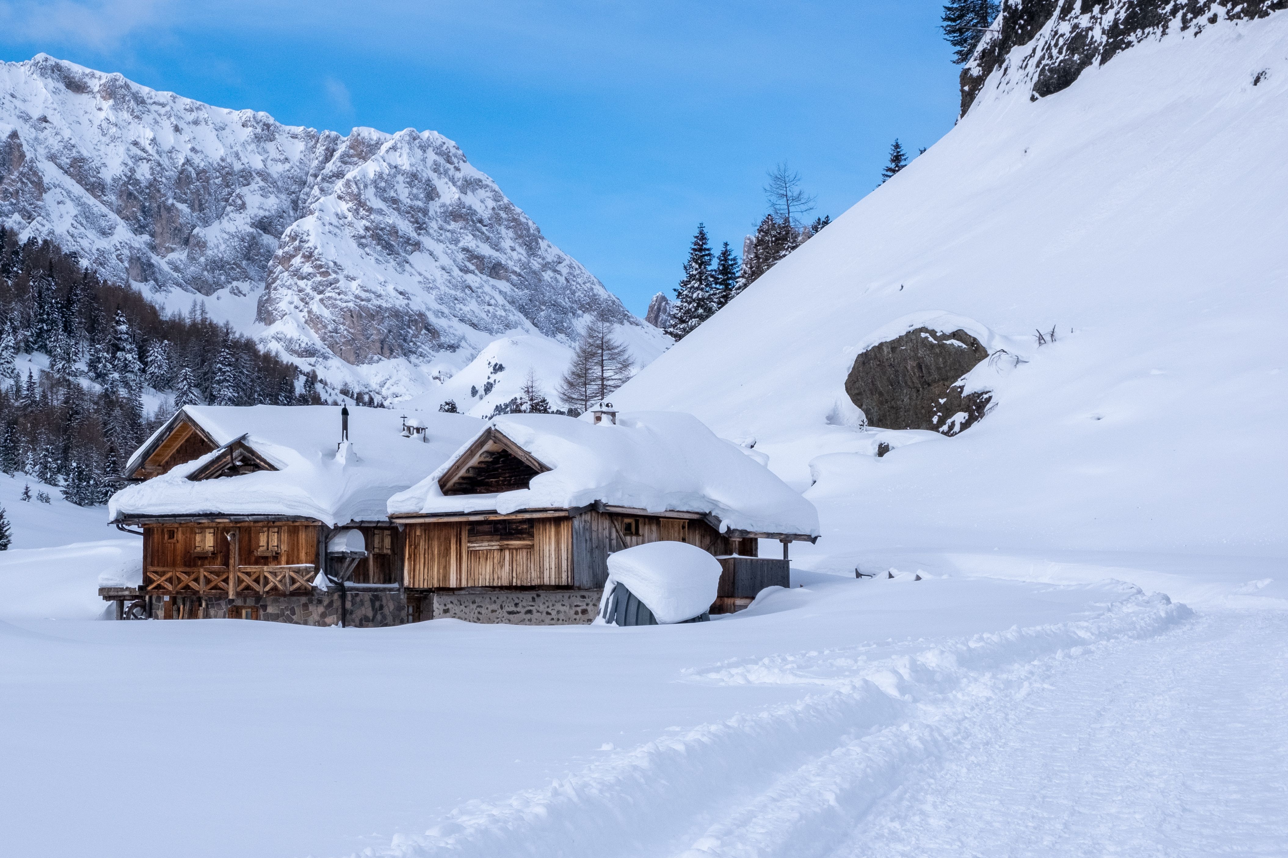 Mountain hut in a snowy mountain scene