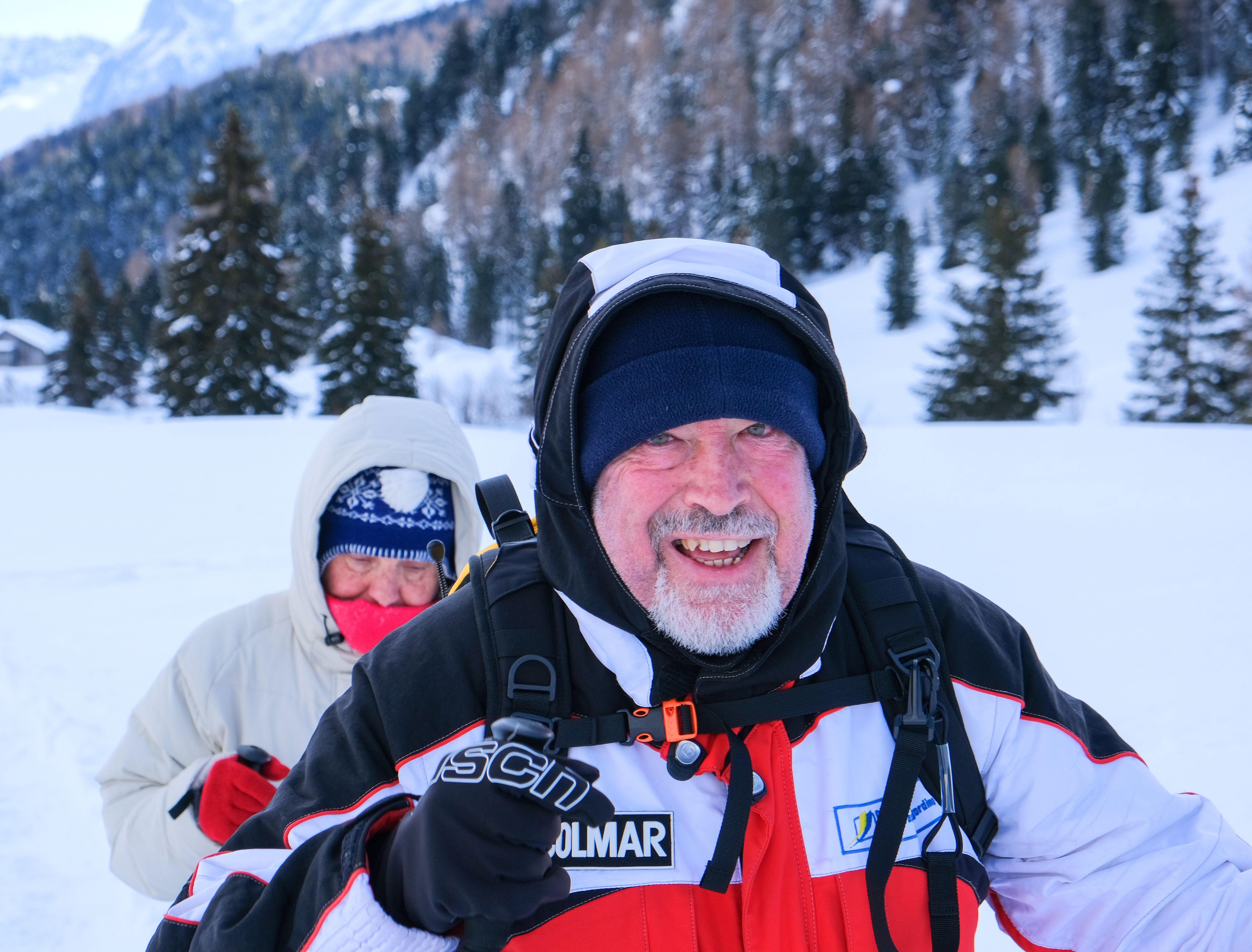 Manwith red face walking in the snow 