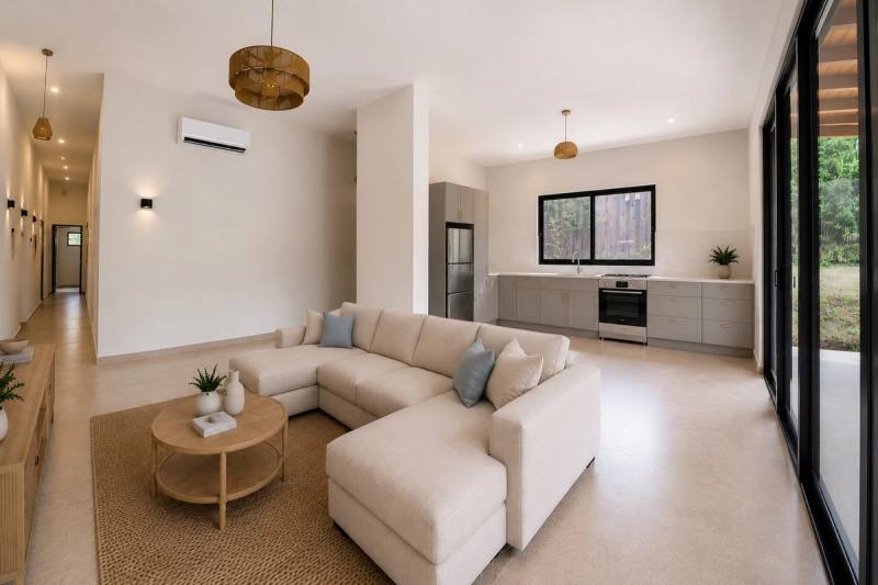Living area and kitchen along the corridor axis of the house