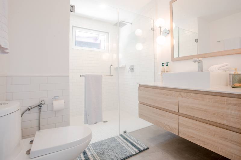 Bathroom with a walk-in shower and a freestanding vanity