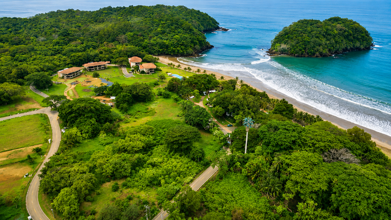 Aerial of Villa Marina's cove with the lodge and the pool