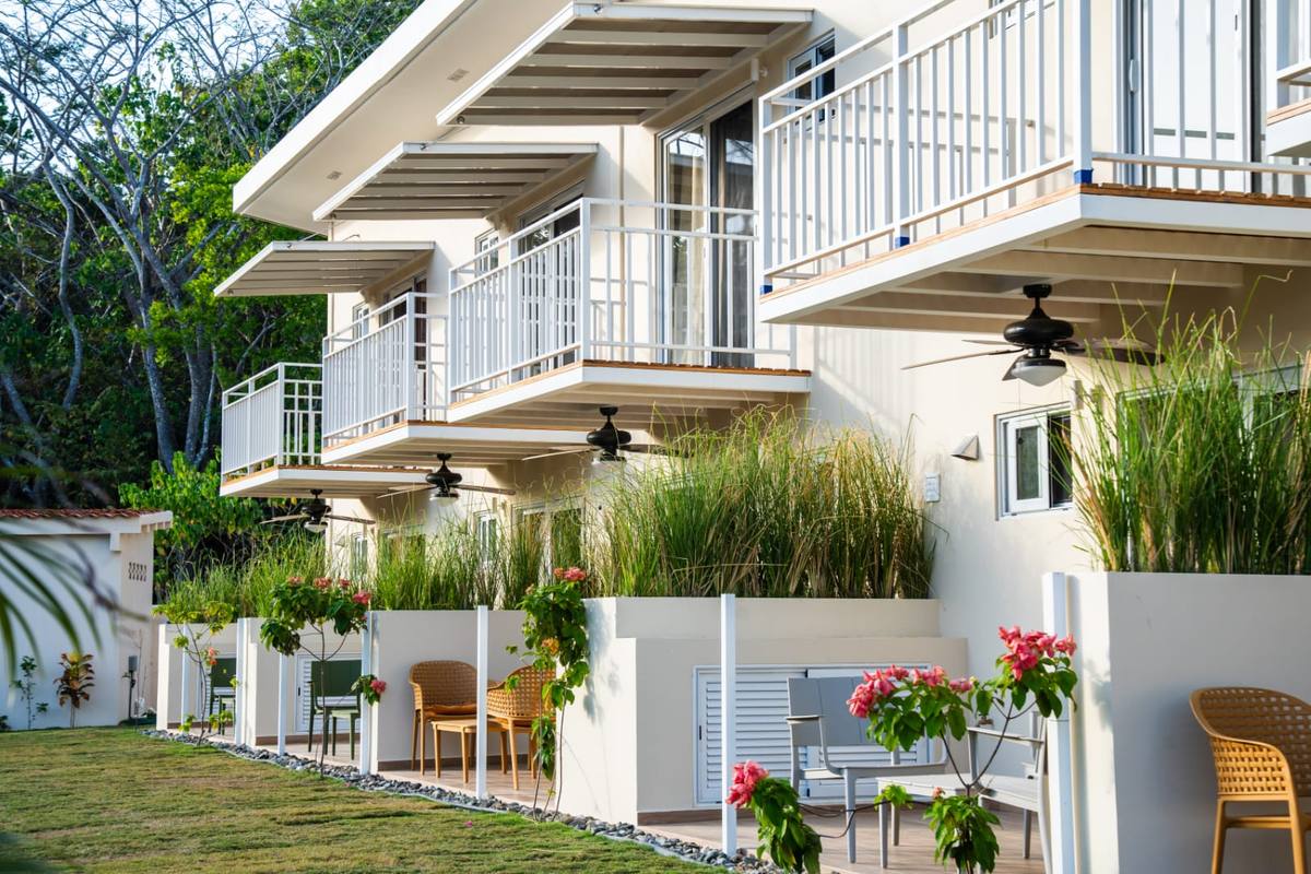 Terraces along the front of the building with planted borders