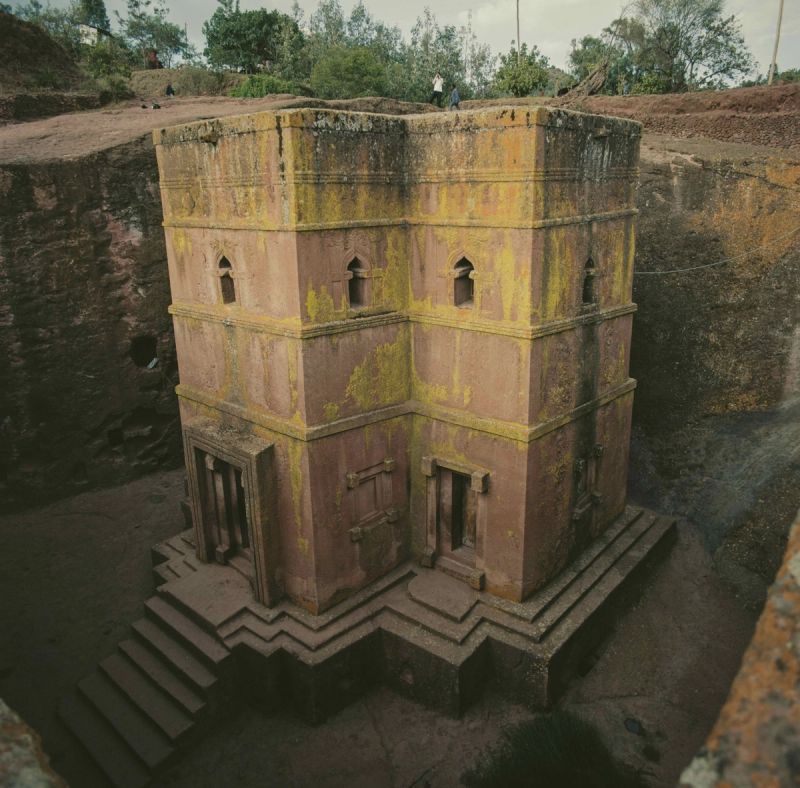 Carved rock church with yellow lichen in a quarry, Ethiopia