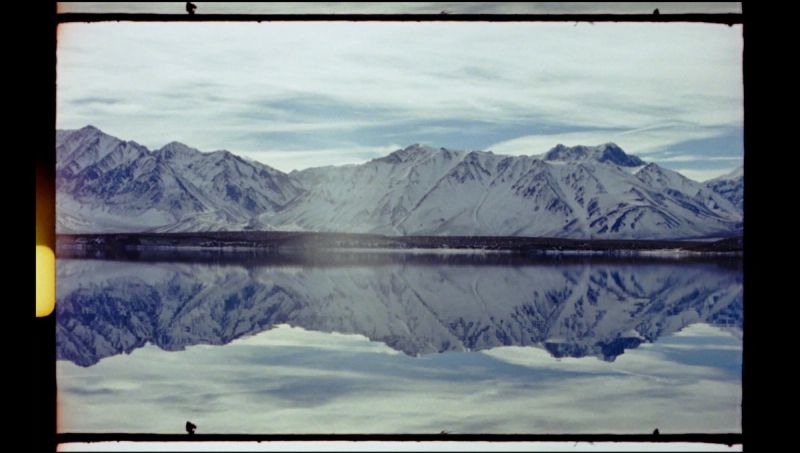 Snow-capped mountains reflected in calm water, location for Toyota Olympics snowboarding project.