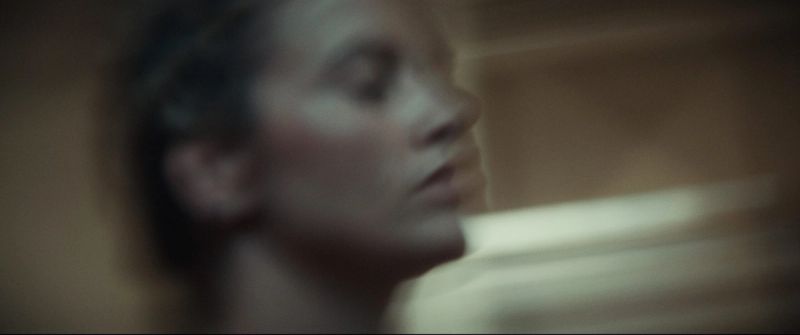Cinematic profile portrait of Olympic wrestler Helen Maroulis in soft window light.