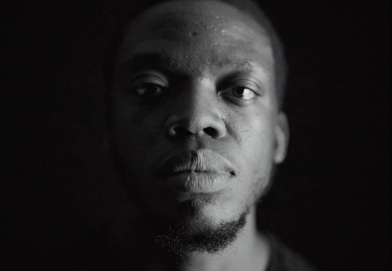 Black and white portrait of Reggie Jackson, LA Clippers player, intense gaze.