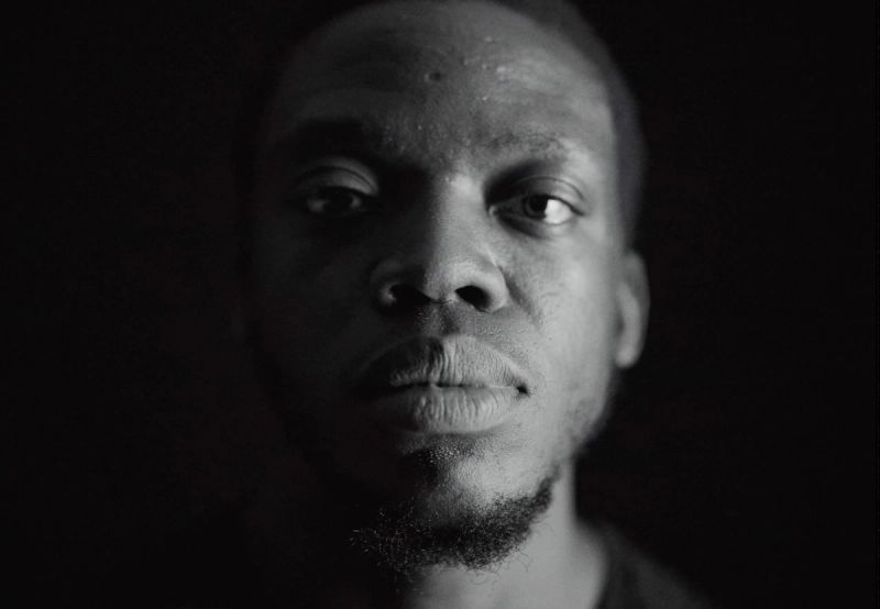 Black and white portrait of Reggie Jackson, LA Clippers player, intense gaze.