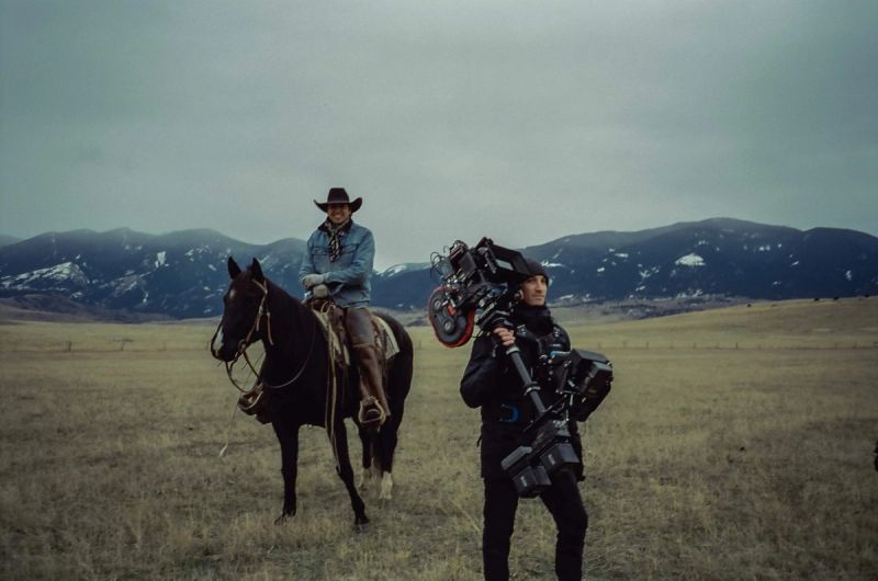 Cinematographer Ian Rigby on horseback in Montana with camera crew and ArriCam equipment
