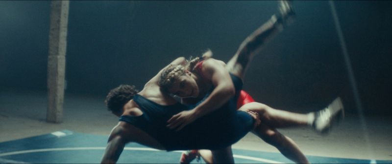 Olympic wrestler Helen Maroulis grappling in a dynamic wrestling match, captured for the EastBay ConqHer project.