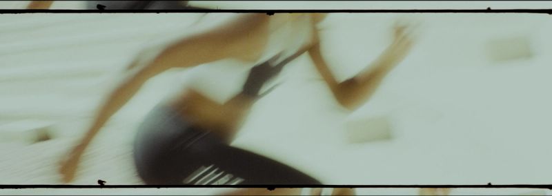 Jen Welter running in motion blur wearing black shorts during Eastbay Santia Deck shoot.