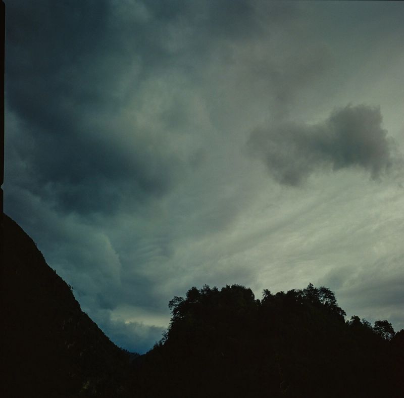 Dark mountain silhouette against a moody, cloudy sky in Patagonia.